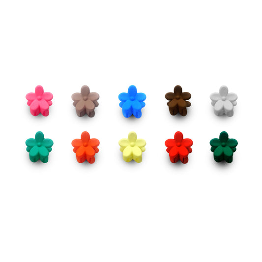 Set of colorful flower-shaped objects on a white background