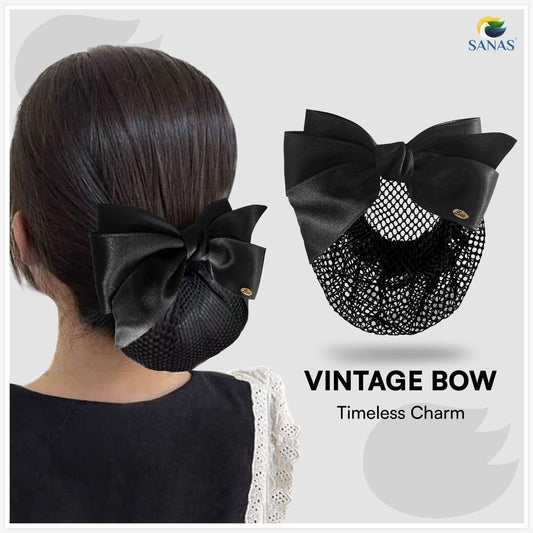 Black vintage bow hair accessory worn by a person with a plain background, featuring the brand 'SANAS'.