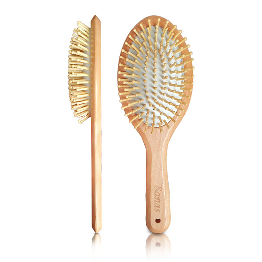 Oval wooden hairbrush with a smooth, natural wood handle and cushioned base. The brush features widely spaced, flexible bristles designed for gentle detangling.