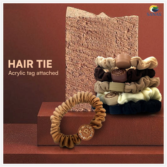 Nude shade scrunchies for hair with decorative stone alphabet charms by SANAS