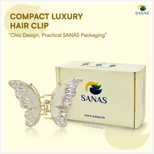 Butterfly hair clip with SANAS packaging on a light yellow background