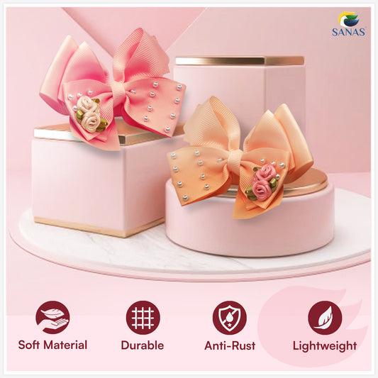 Baby girl hair accessories set featuring pink and peach bow clips
