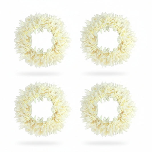 Four cream-colored floral wreaths on a white background