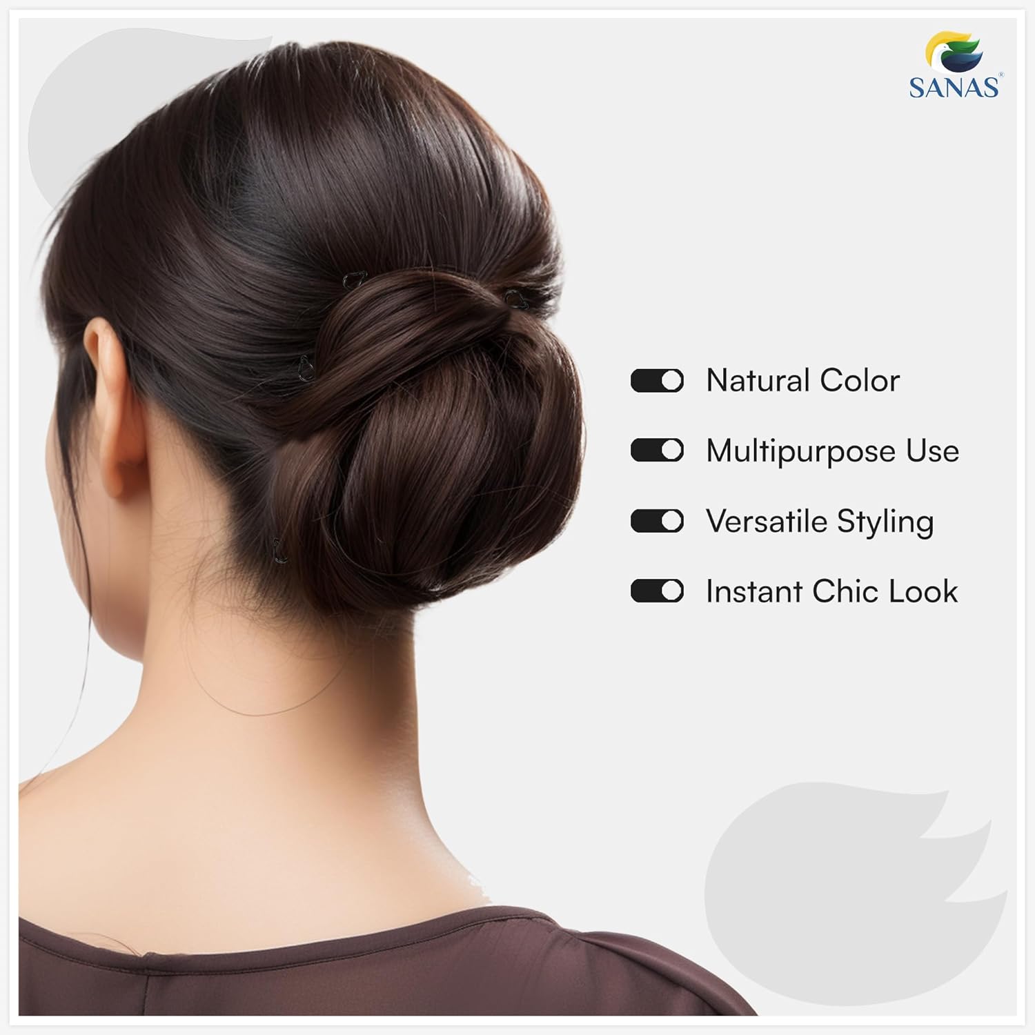 Woman with styled hair bun on a white background with SANAS branding