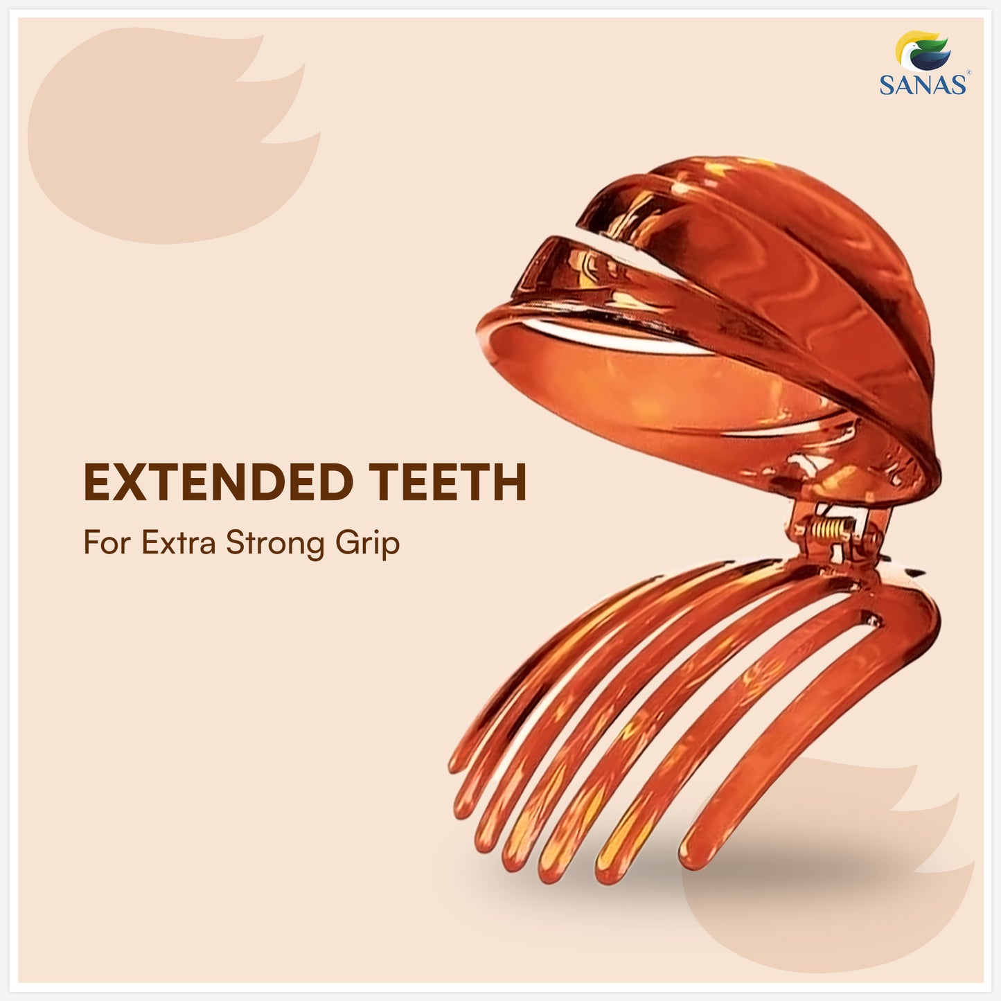 Metallic hair clip with extended teeth on a beige background, featuring the Sanas brand.