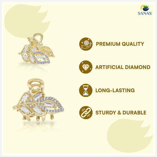 Gold leaf-shaped pendant with artificial diamonds on a light yellow background, featuring SANAS brand.
